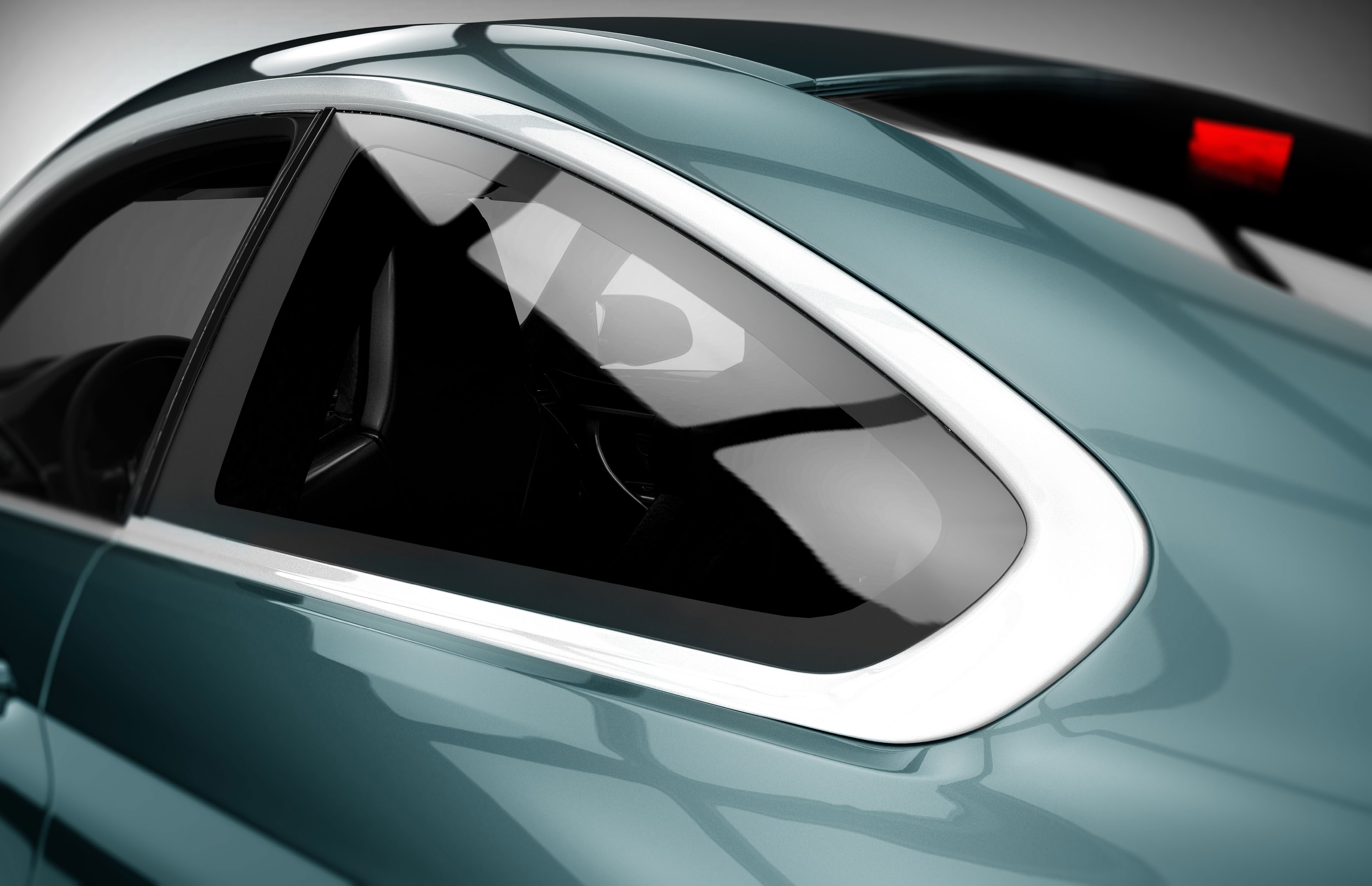 Close-up of a car window and mirror in motion